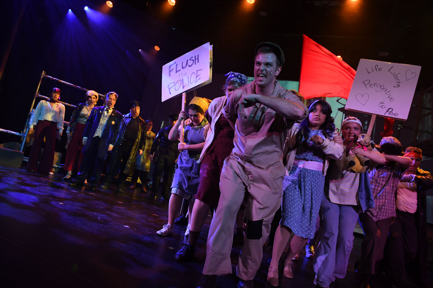 actress singing in front of a shed